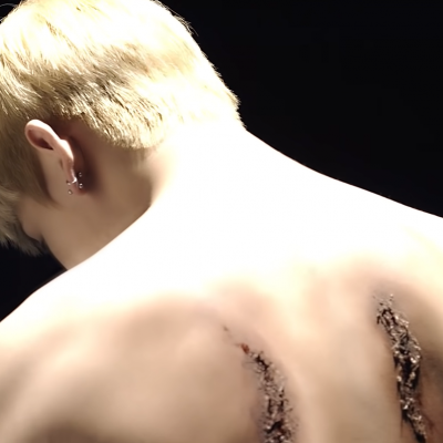 Scars from severed wings on V back (Blood, Sweat & Tears)